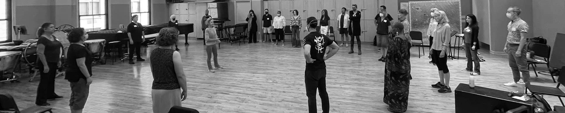 Participants in the 2022 National Congress of Acting Teachers stand in a circle